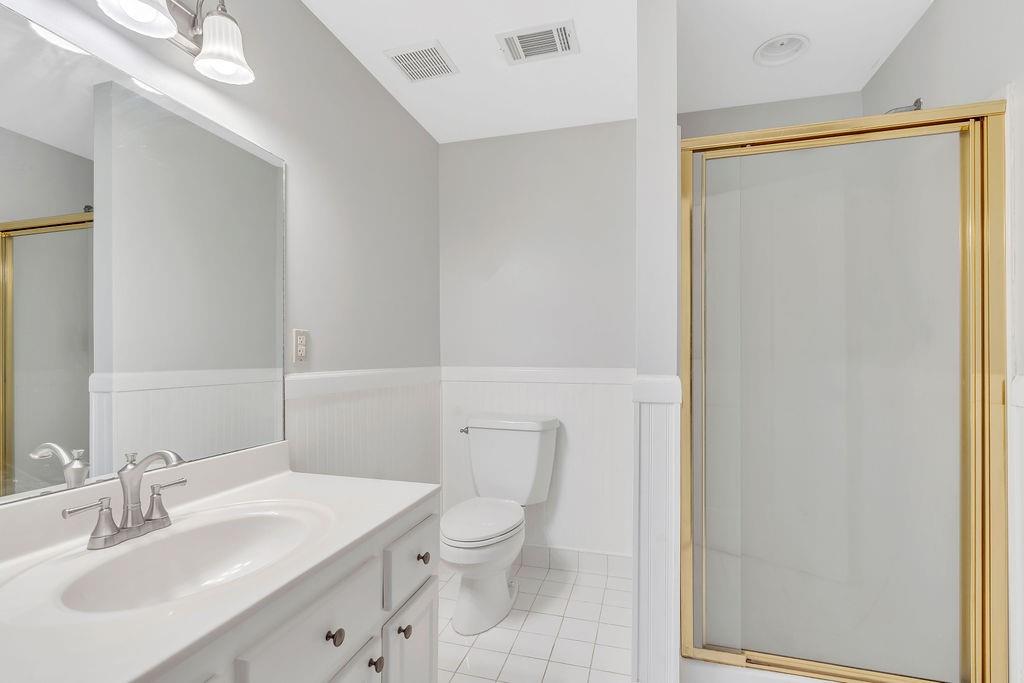 357 John's Way Talking Rock, GA 30175 - Photo 40 of 63 a bathroom with a toilet a sink and a mirror