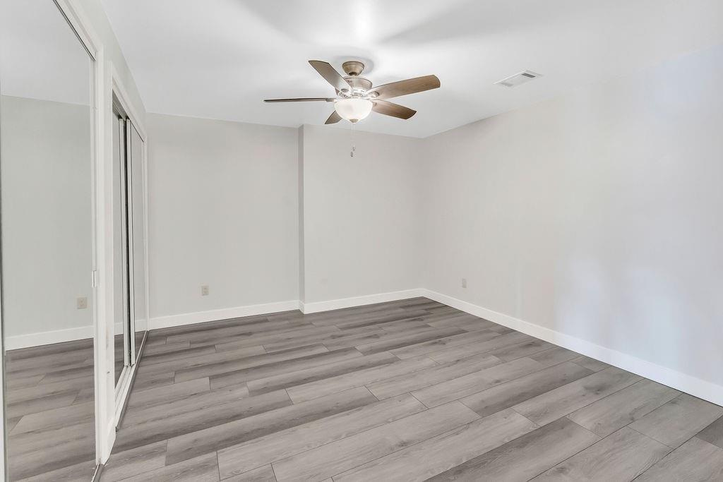 357 John's Way Talking Rock, GA 30175 - Photo 41 of 63 a view of empty room with wooden floor and ceiling fan