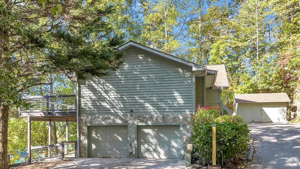 357 John's Way Talking Rock, GA 30175 - Photo 51 of 63 a backyard of a house with large trees and plants