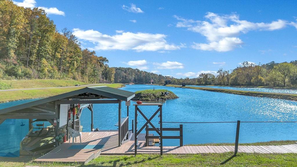 357 John's Way Talking Rock, GA 30175 - Photo 61 of 63 a view of a lake with couches and table