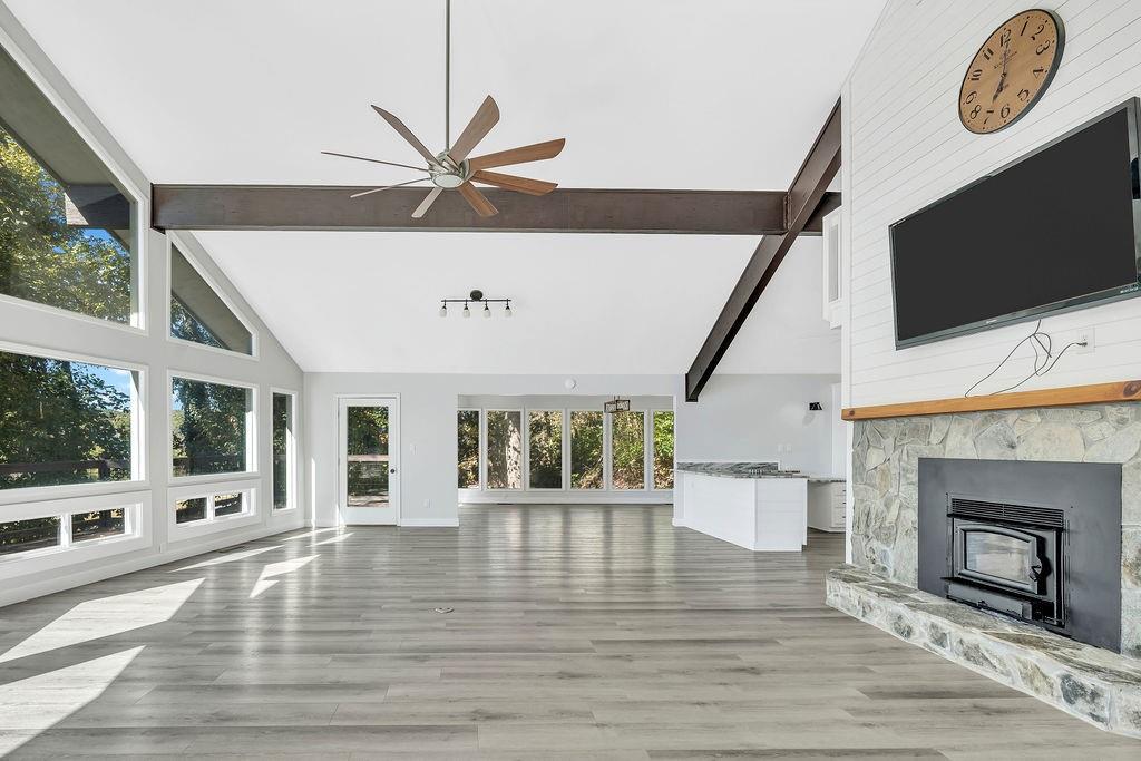 357 John's Way Talking Rock, GA 30175 - Photo 7 of 63 a view of an empty room with a fireplace and a window