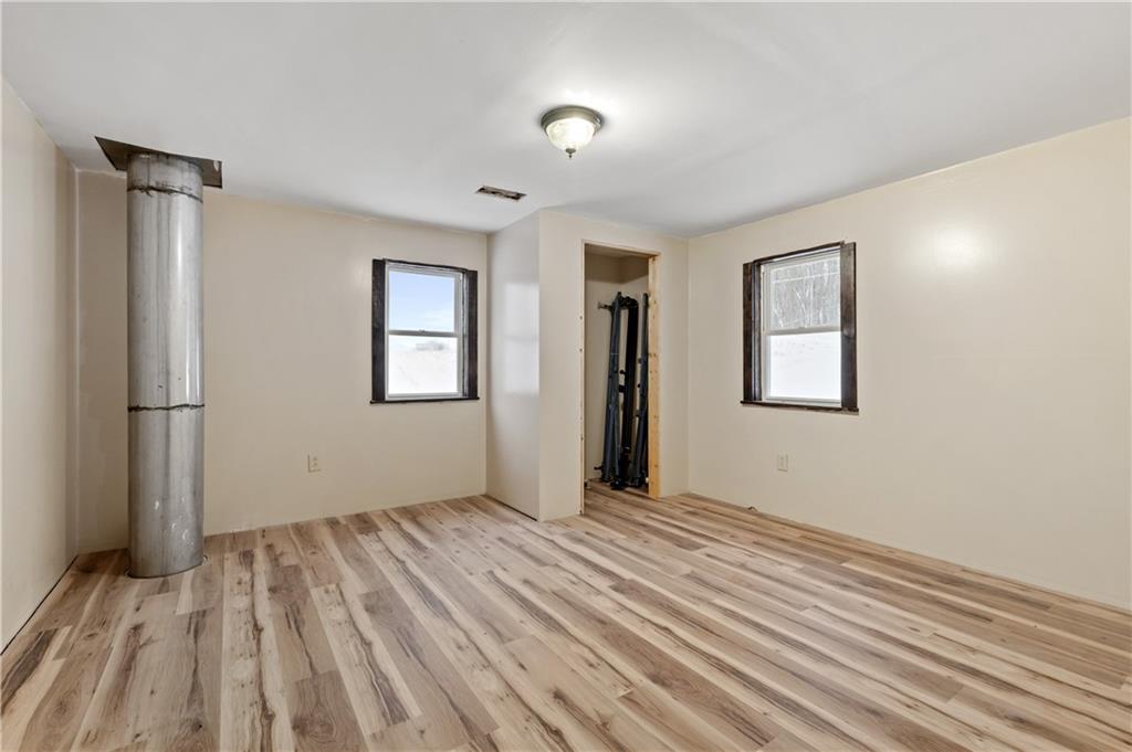 1575 Windows Road Smicksburg, PA 16256 - Photo 31 of 35 a view of an empty room with wooden floor and a window