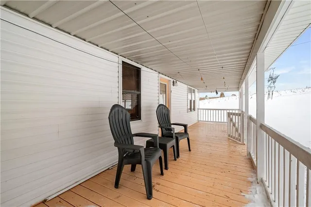 a view of white house with a yard