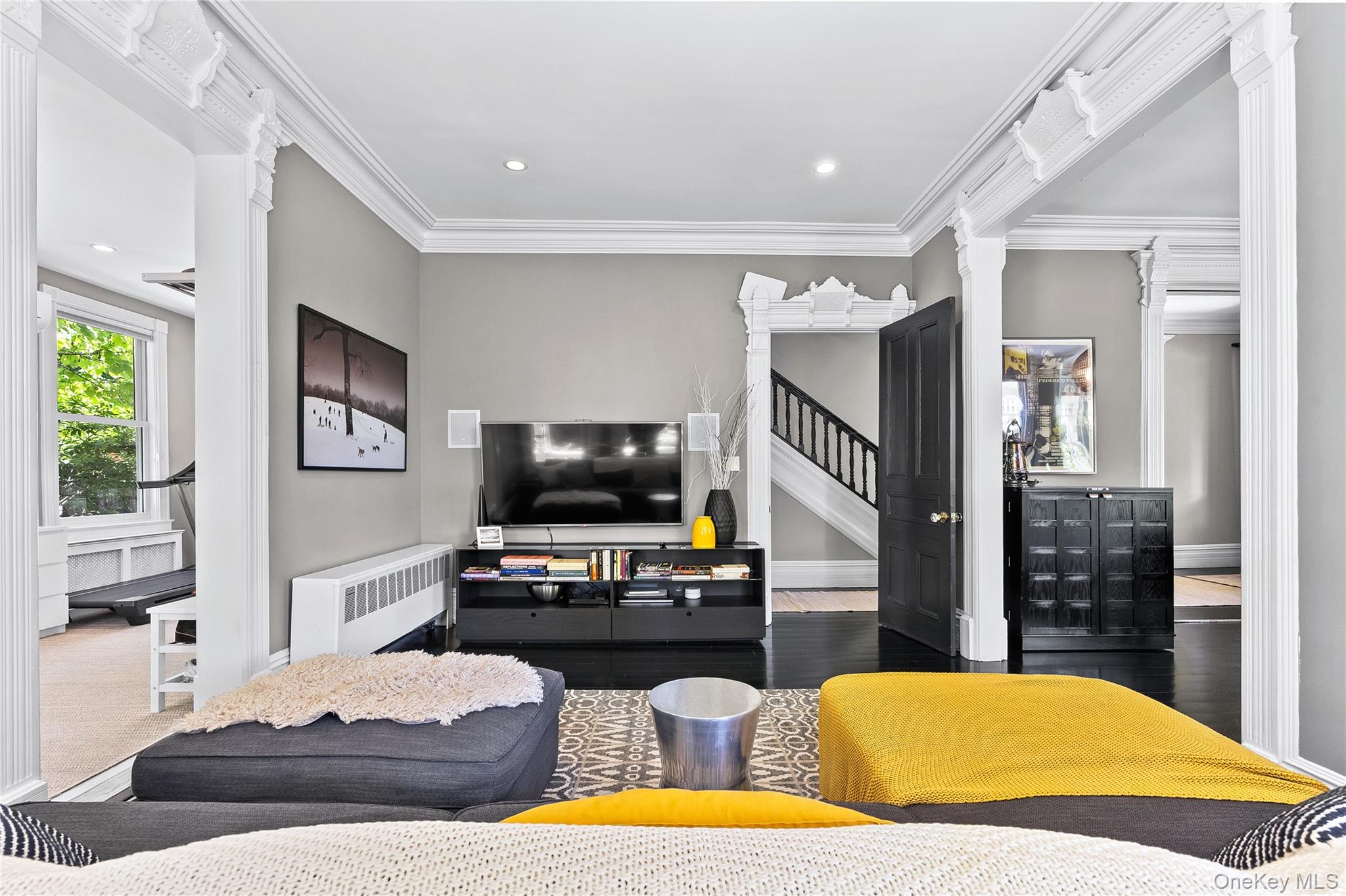 19 Howe Place Bronxville, NY 10708 - Photo 8 of 37 Living area featuring high ceilings, dark wood-finish flooring, decorative crown molding, and recessed lighting