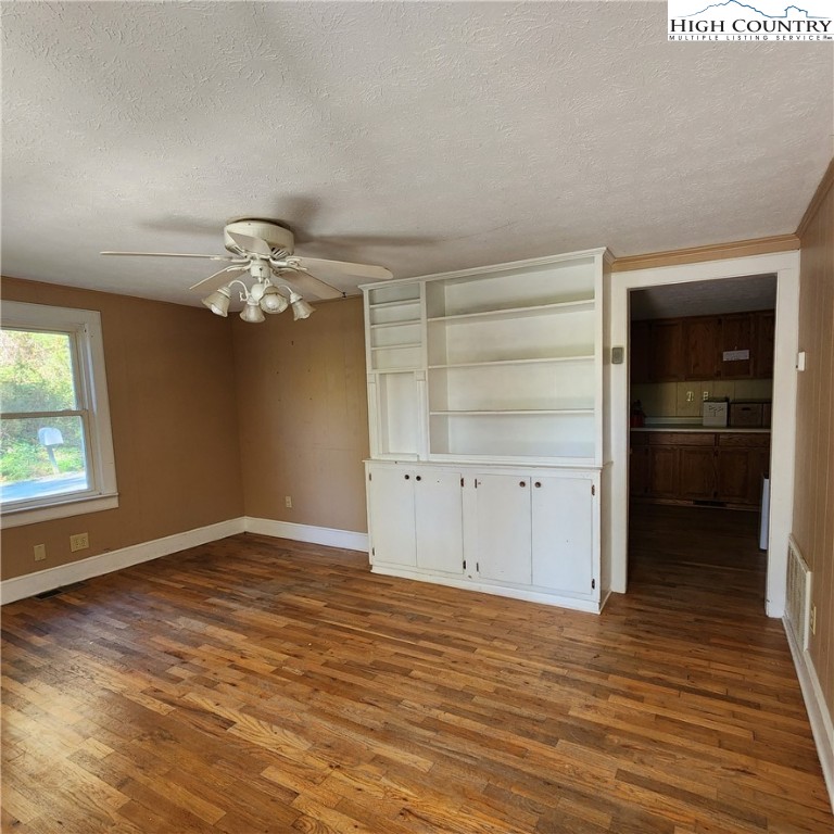 336 Willowdale Church Road Vilas, NC 28692 - Photo 12 of 35 wooden floor in an empty room with a window