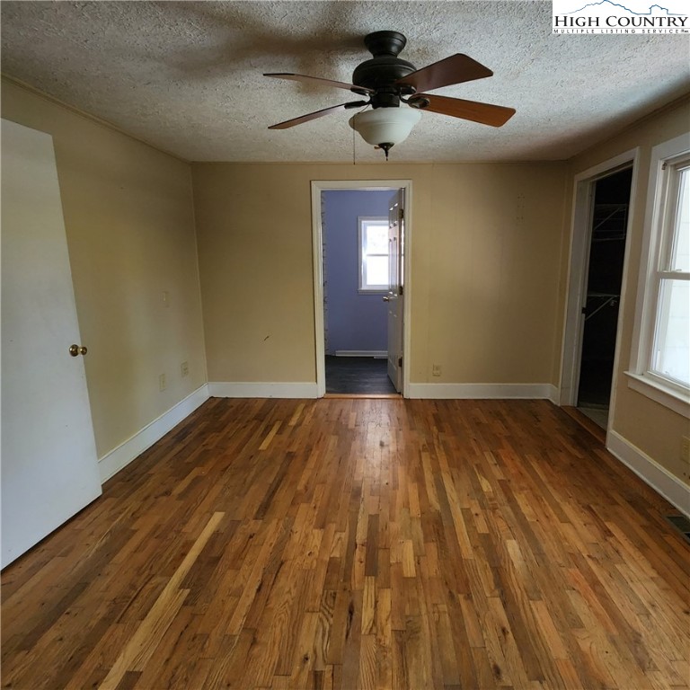 336 Willowdale Church Road Vilas, NC 28692 - Photo 14 of 35 a view of empty room with wooden floor and fan