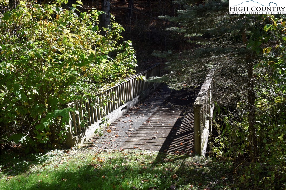336 Willowdale Church Road Vilas, NC 28692 - Photo 28 of 35 a view of a pathway both side of the house