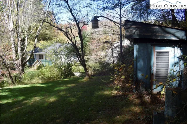 a backyard of a house with lots of green space