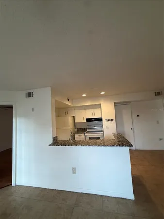 a view of kitchen with stainless steel appliances