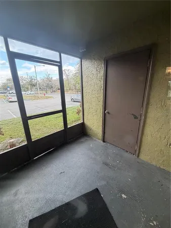 a view of a room with large windows