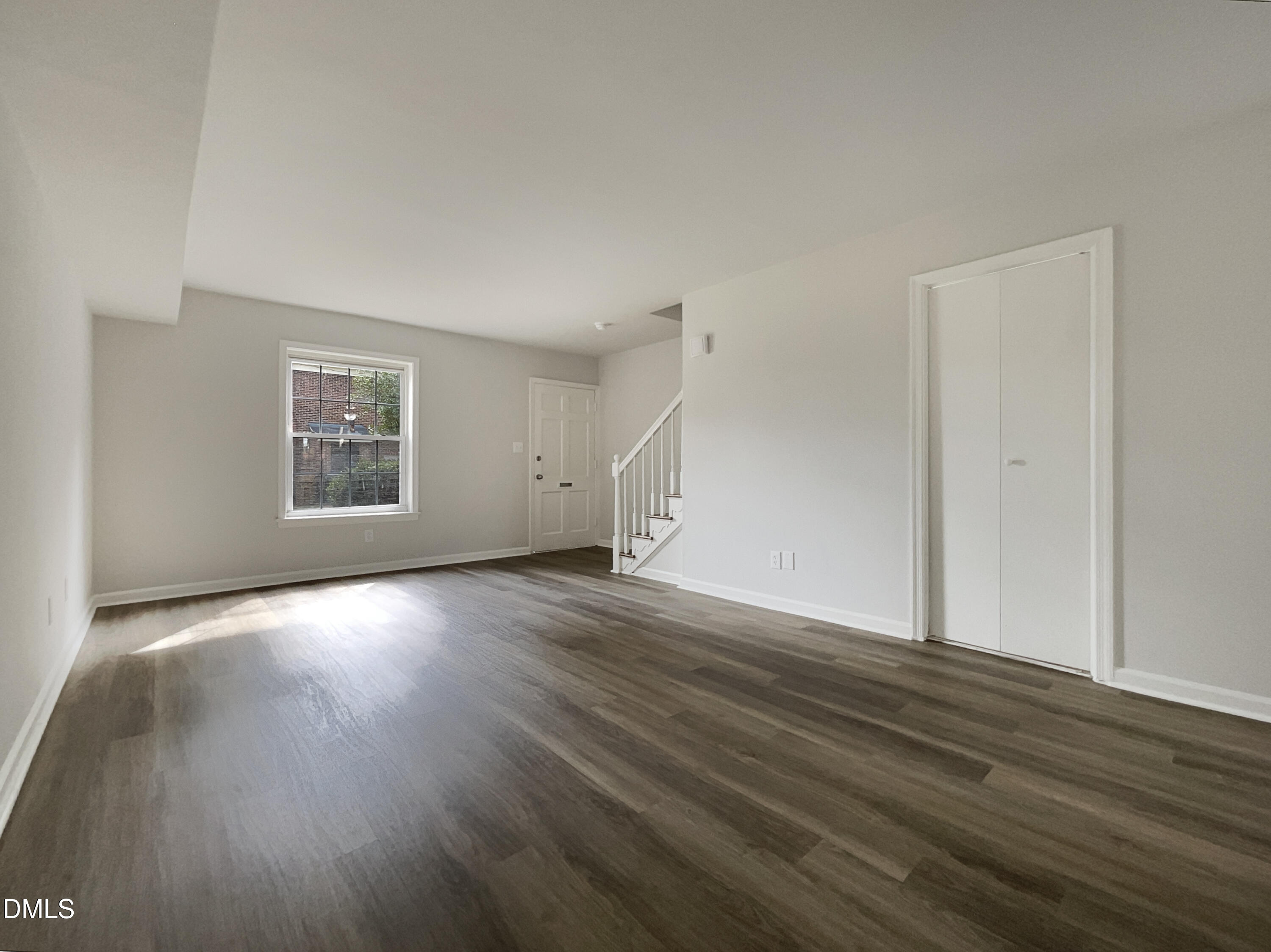 3737 Jamestown Circle Raleigh, NC 27609 - Photo 3 of 14 a view of an empty room with wooden floor and a window