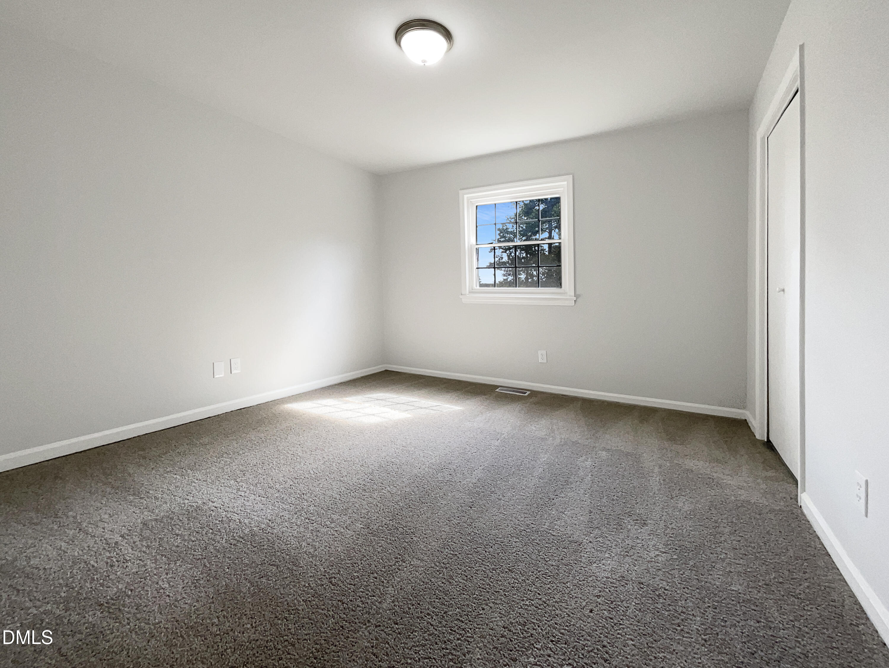 3737 Jamestown Circle Raleigh, NC 27609 - Photo 4 of 14 an empty room with a window