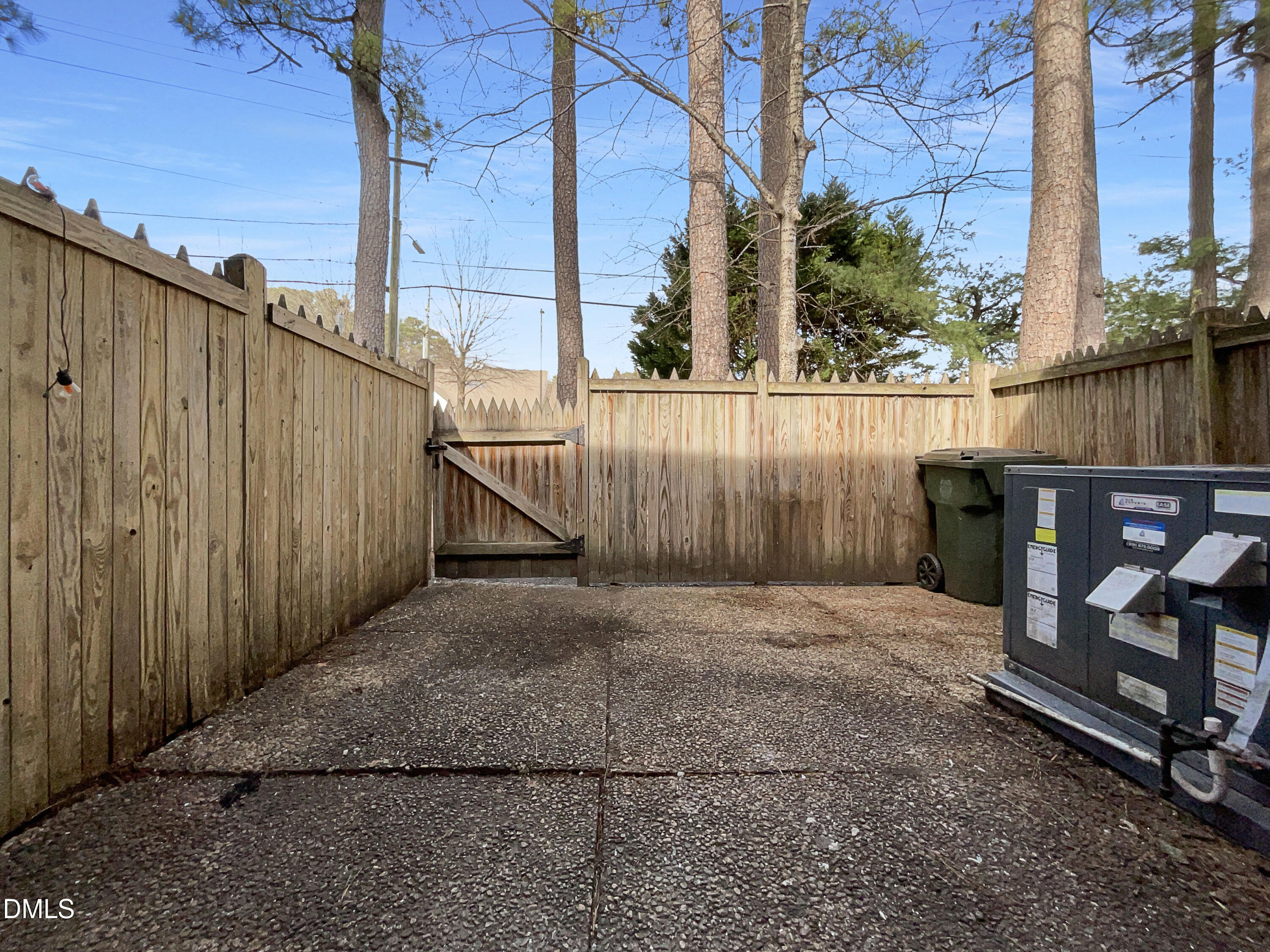 3737 Jamestown Circle Raleigh, NC 27609 - Photo 5 of 14 a view of a backyard with a wooden fence