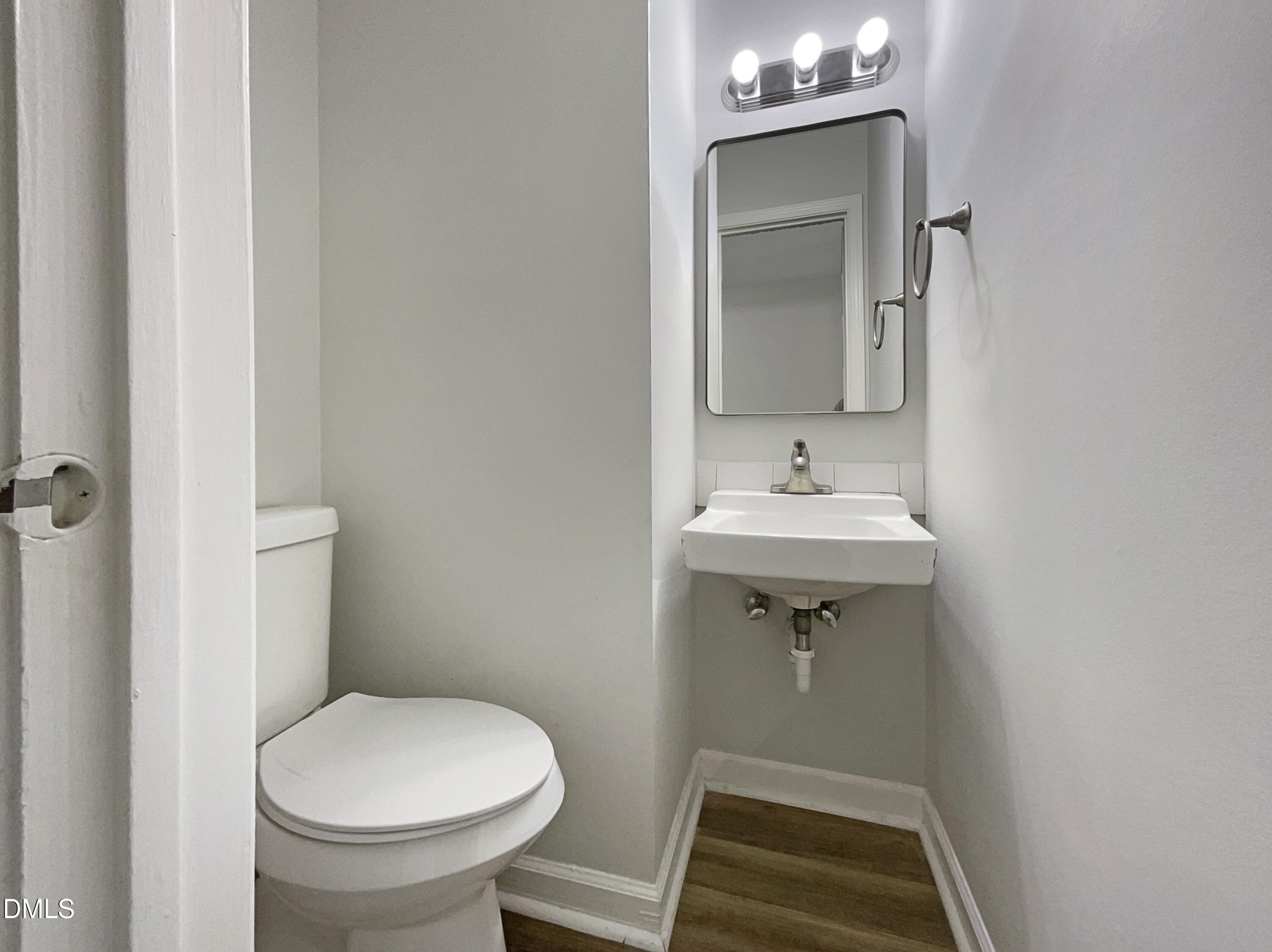 3737 Jamestown Circle Raleigh, NC 27609 - Photo 6 of 14 a bathroom with a sink toilet and vanity