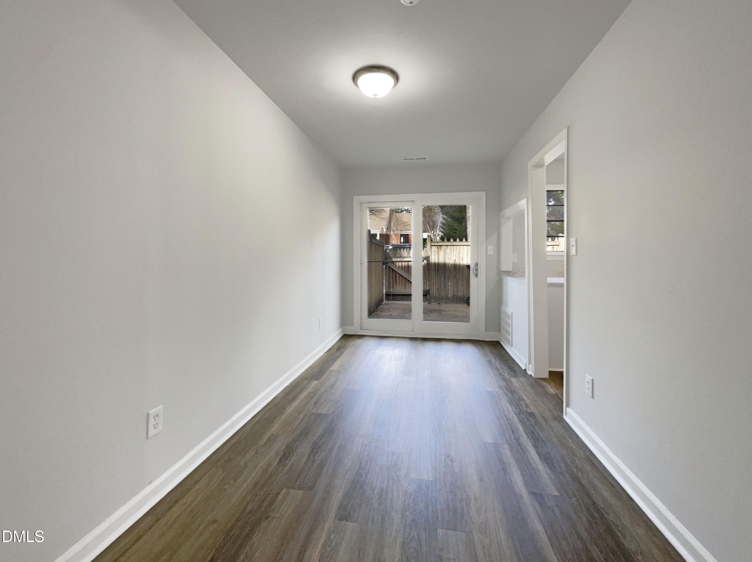 3737 Jamestown Circle Raleigh, NC 27609 - Photo 8 of 14 wooden floor in an empty room with a window