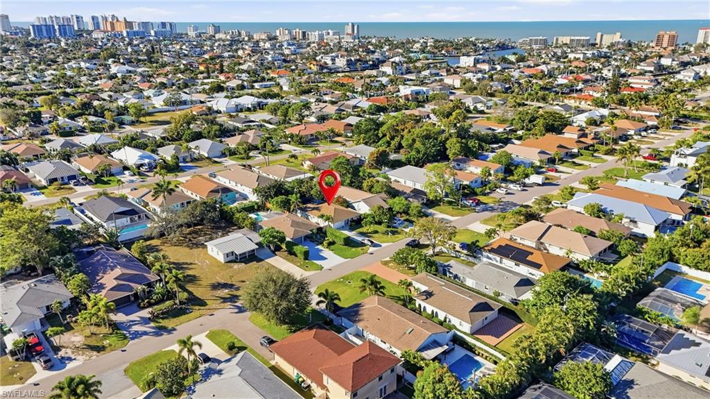 560 109th Avenue North Naples, FL 34108 - Photo 1 of 37 an aerial view of a city with lots of residential buildings