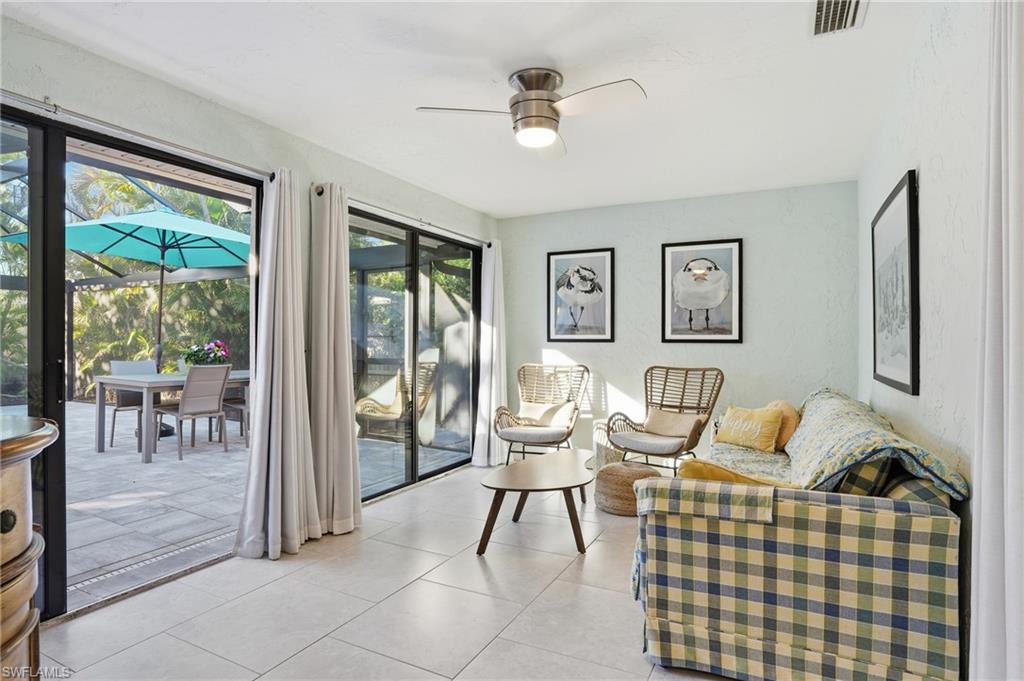 560 109th Avenue North Naples, FL 34108 - Photo 22 of 37 a living room with furniture