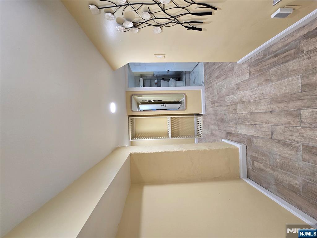 282 Harding Avenue, Unit 1 Teaneck, NJ 07666 - Photo 11 of 21 a view of empty room with wooden floor