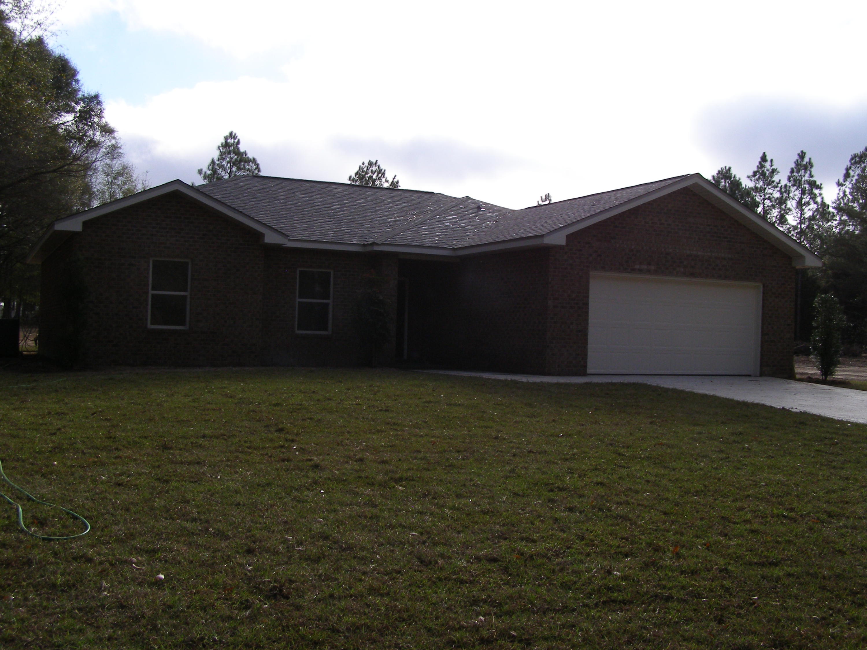 771 Ridge Lake Road Crestview, FL 32536 - Photo 3 of 19 a house that has a tree in front of it