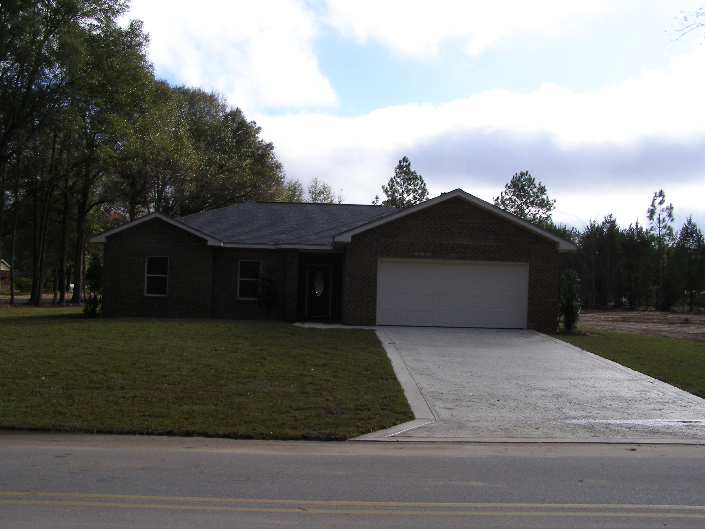 771 Ridge Lake Road Crestview, FL 32536 - Photo 4 of 19 a front view of a house with garden