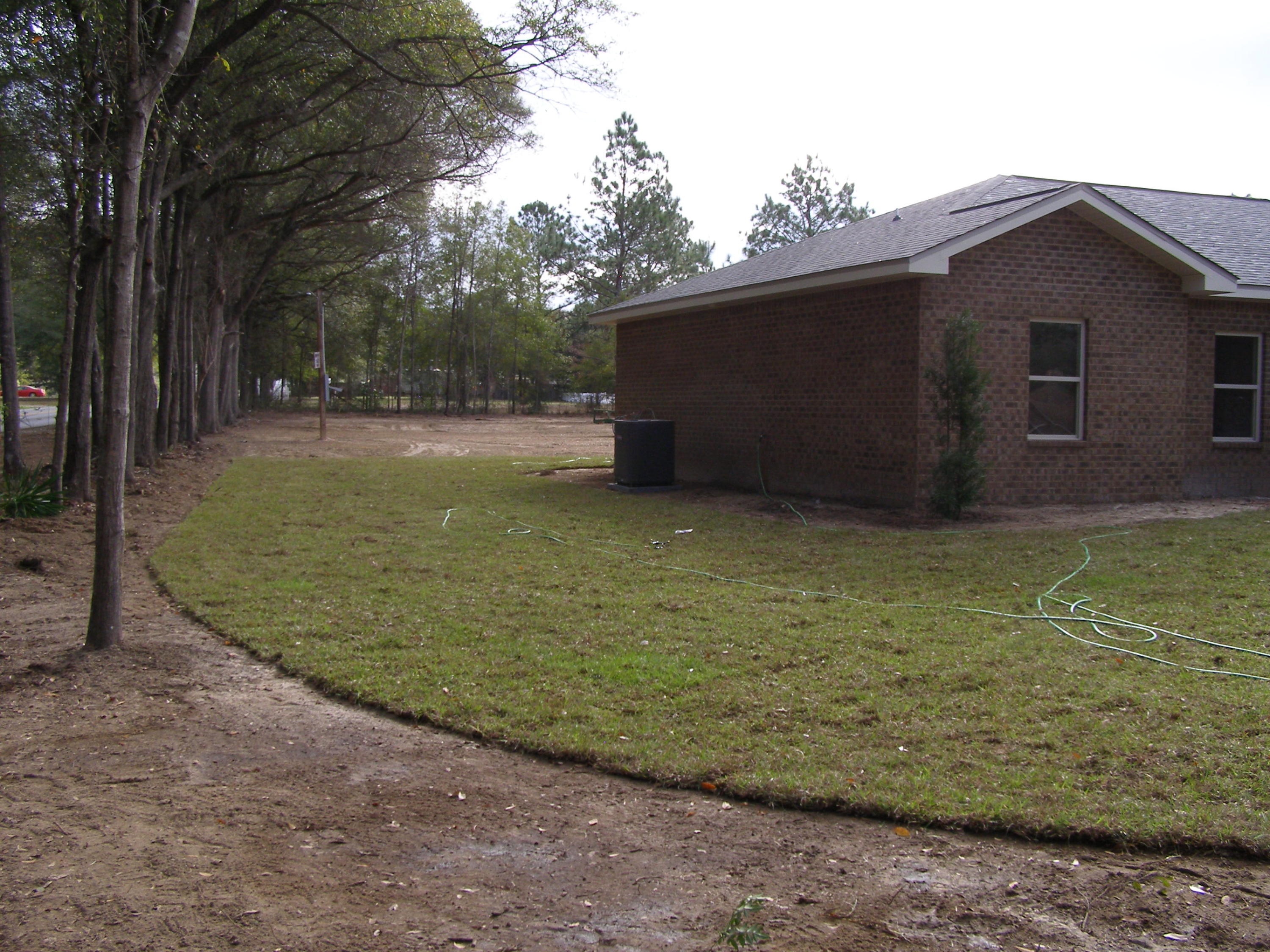 771 Ridge Lake Road Crestview, FL 32536 - Photo 6 of 19 a view of a backyard with large trees