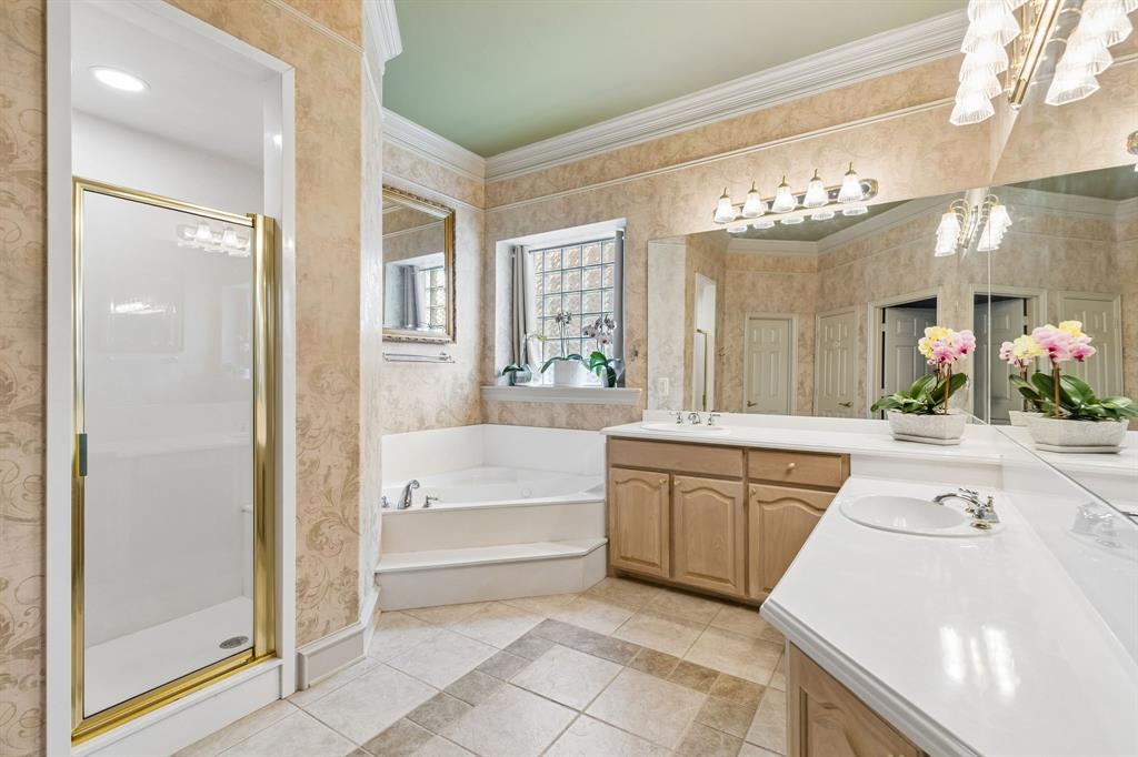 8517 Navigation Drive Rowlett, TX 75088 - Photo 22 of 39 a large spacious bathroom with a large tub shower and sink