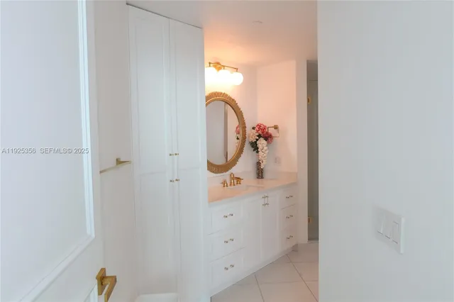 a bathroom with a sink and mirror