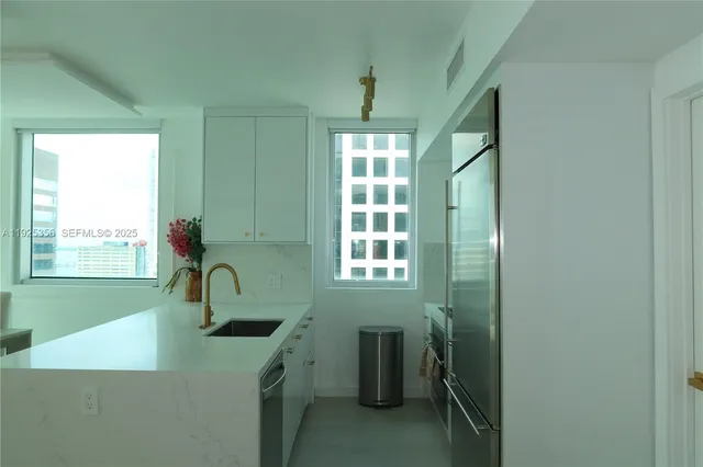 a kitchen with a sink and a window
