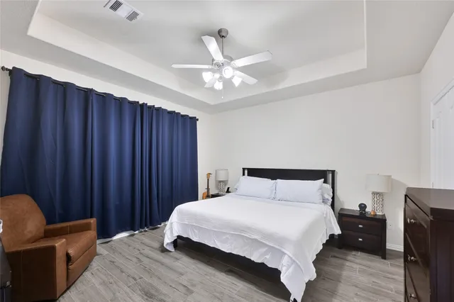 a kitchen with stainless steel appliances granite countertop a lot of counter space and wooden floor
