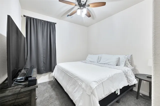a bathroom with sink mirror and toilet