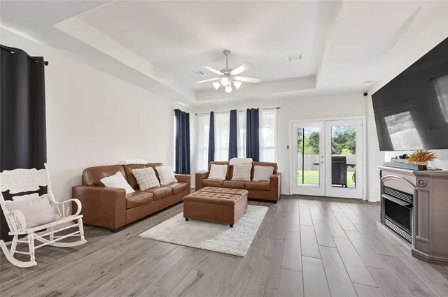 a living room with furniture and a flat screen tv
