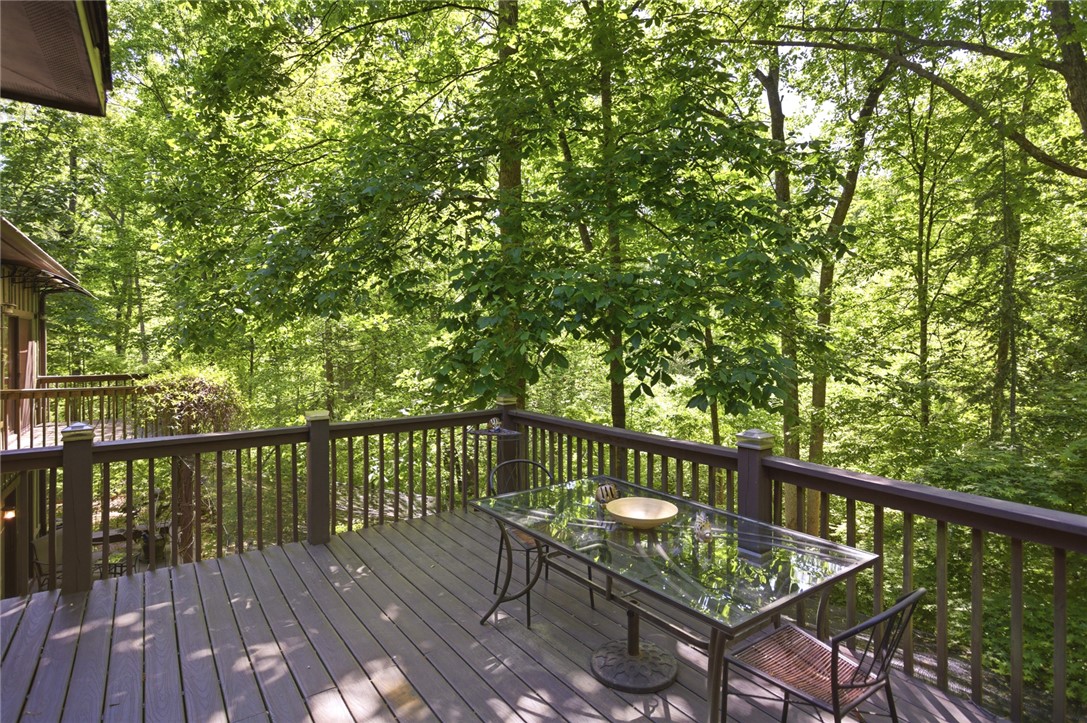 215 Inlet Pointe Drive Anderson, SC 29625 - Photo 24 of 47 This tranquil deck offers a peaceful retreat nestled among a lush, verdant treeline.