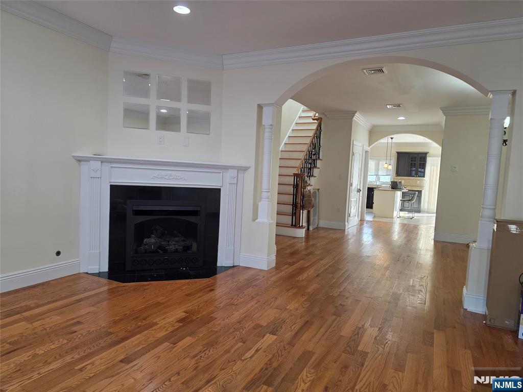 336 Roff Avenue, Unit A Palisades Park, NJ 07650 - Photo 3 of 9 a view of a livingroom with wooden floor and a fireplace