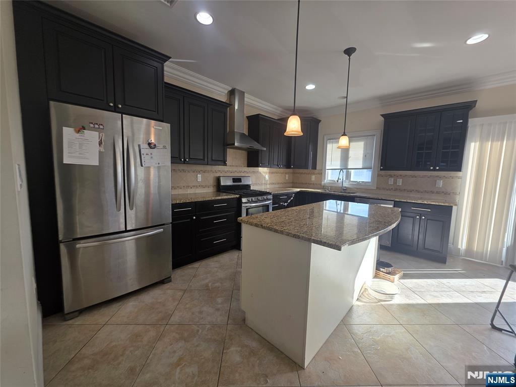 336 Roff Avenue, Unit A Palisades Park, NJ 07650 - Photo 4 of 9 a kitchen with stainless steel appliances granite countertop a refrigerator a sink a stove and a wooden cabinets