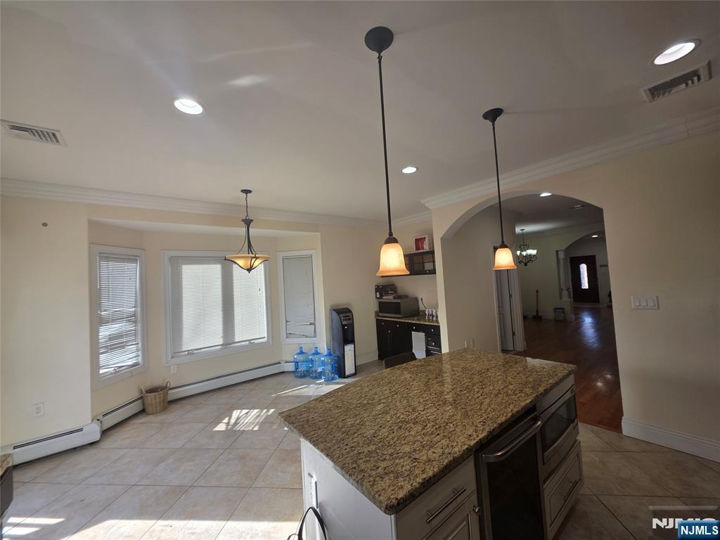 336 Roff Avenue, Unit A Palisades Park, NJ 07650 - Photo 5 of 9 a kitchen with a stove center island and a wooden floor