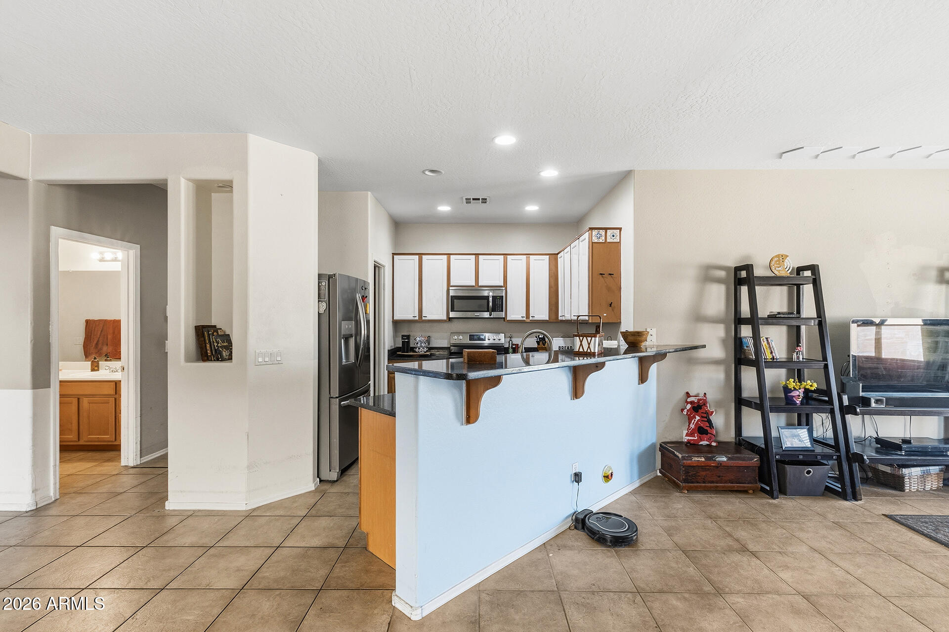 6718 West Darrel Road Laveen, AZ 85339 - Photo 33 of 49 a view of a living room and kitchen