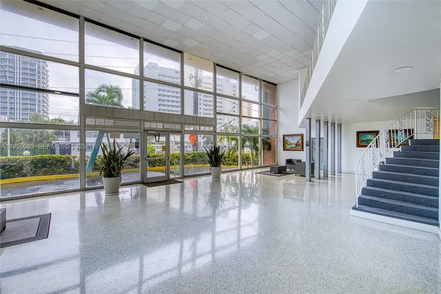 a view of an entryway with a floor to ceiling window in an empty room