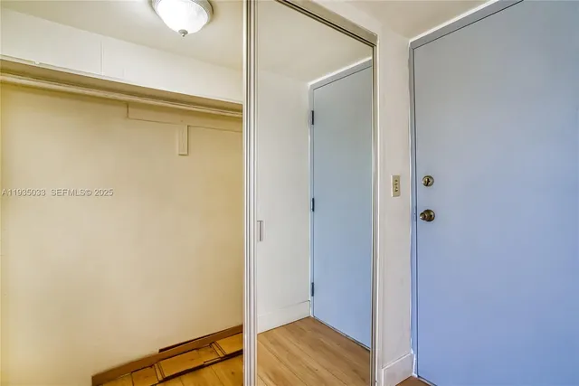 a view of front door with wooden floor