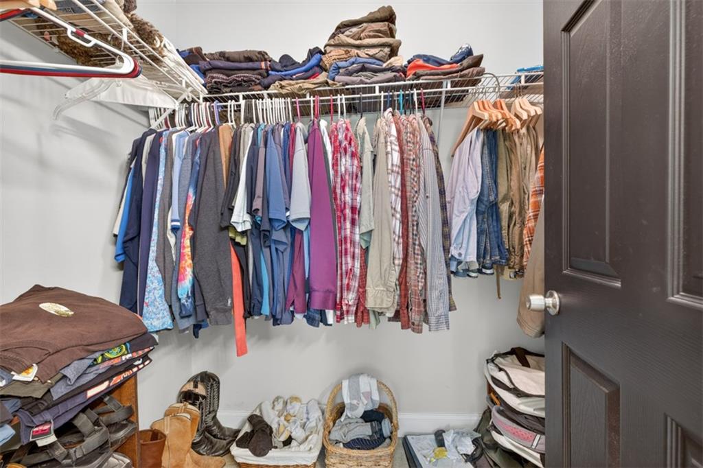89 Katie Spring Lane Jefferson, GA 30549 - Photo 39 of 63 a view of walk in closet with clothes and shoes