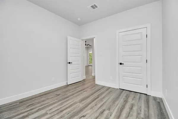 wooden floor and closet in a room
