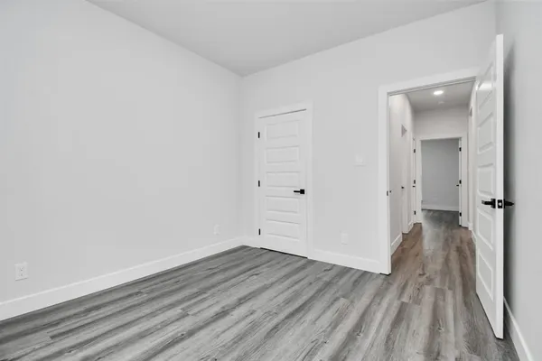 wooden floor and white walls