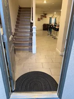 a room with furniture and mirror