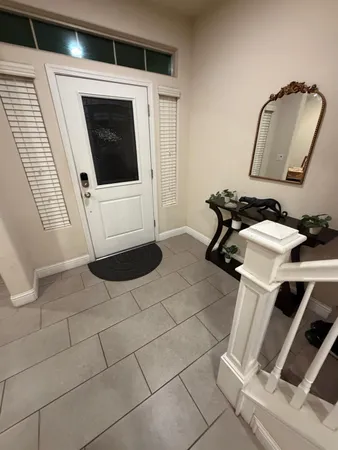 a large kitchen with kitchen island a sink stove and cabinets