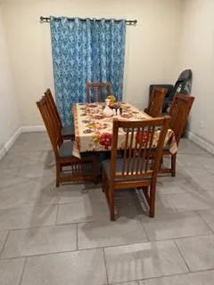 a kitchen with stainless steel appliances granite countertop a sink a stove and a wooden cabinets
