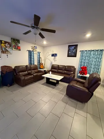 a room with pool table and wall paintings