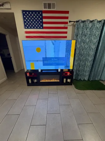 a living room with furniture gym equipment and a table