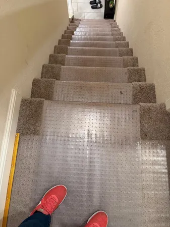 a view of street and with car parked