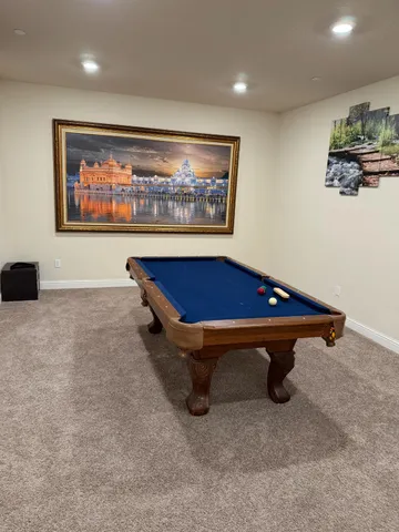 a view of a street with a building and trees in the background