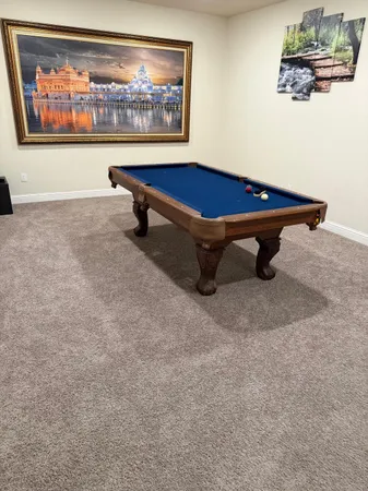 a view of backyard with outdoor seating and green space