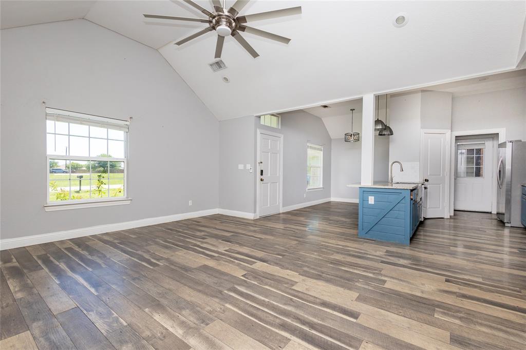 512 Milton Road Josephine, TX 75173 - Photo 7 of 31 a view of empty room with wooden floor and window